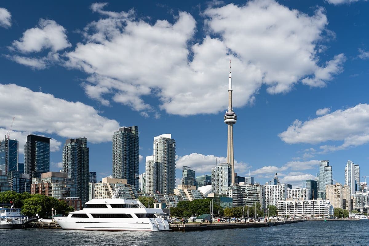 The Toronto waterfront and the CN Tower under a bright sky